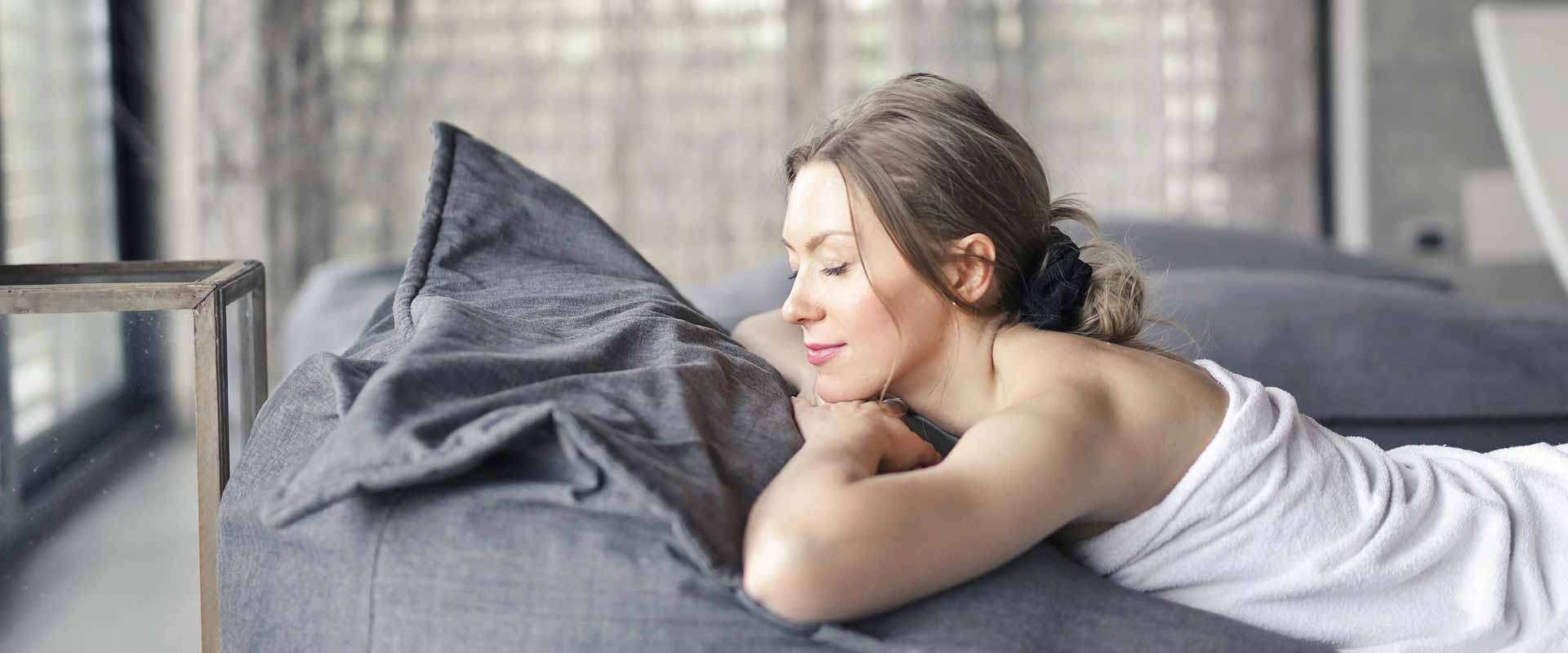 beautiful woman relaxing ona bed and waiting for treatment