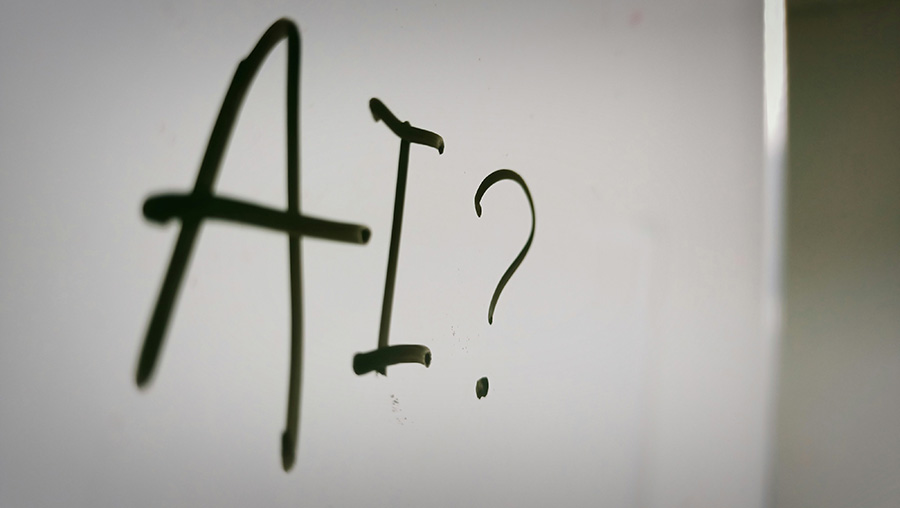 The word AI? written on white board.